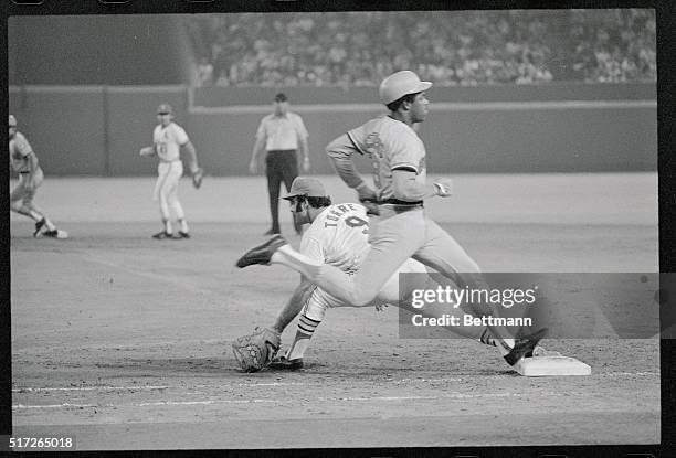St. Louis, Missouri: Houston Astros' Cesar Cedeno legs out a bunt as St. Louis Cardinals' first baseman Joe Torre takes the late throw from Ken Reitz...