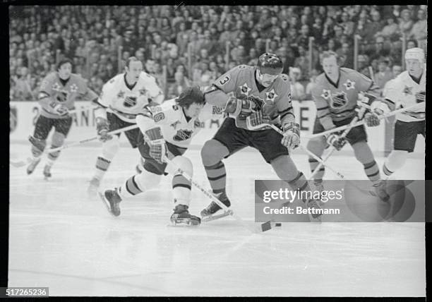 St. Louis' Don Awrey of the West Division and Islanders' Denis Potvin of the East battle for the puck in the first period of the 26th annual National...