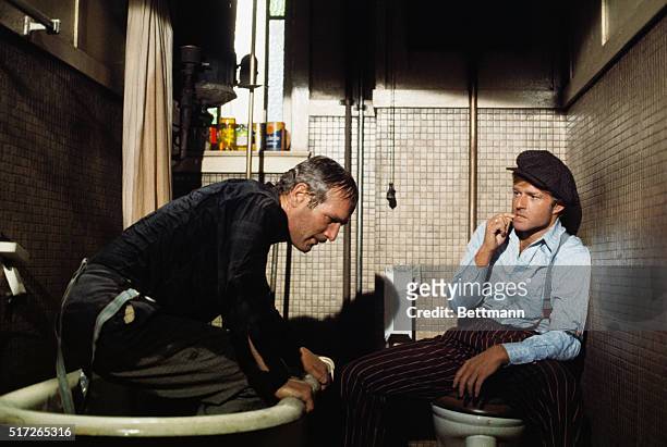 Robert Redford and Paul Newman shown in scene from The Sting, which won the "Best Picture of 1973" Oscar, directed by George Roy Hill and released by...