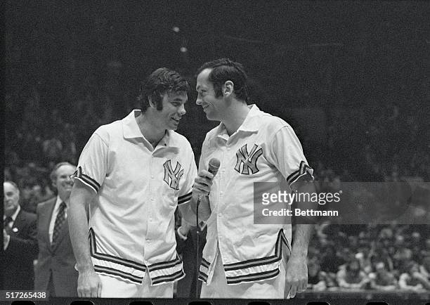 New York, New York: Dave DeBusschere , honored by his fans and teammates, laughs with his roommate Bill Bradley during the pregame ceremonies....