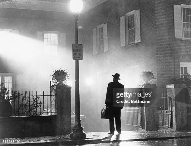 Movie still from "The Exorcist" showing Max Von Sydow standing outside the McNeil home. This photograph was the one used in the advertising campaign...
