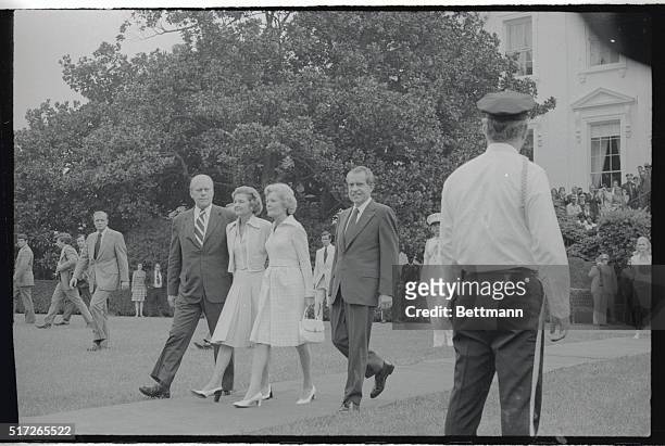 Mrs. Pat Nixon seems to be fighting back tears here, as she leaves the White House for the last time as the First Lady. Betty Ford, the new First...