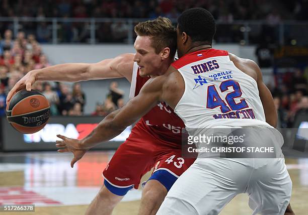 Bamberg's Croatian center Leon Radosevic and Moscow's US forward Kyle Hines vie for the ball during the EuroLeague top 16 Group F basketball match...