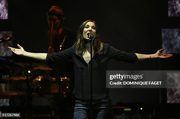 French singer Zazie performs at the Folies Bergeres theater in Paris on March 24, 2016. / AFP / DOMINIQUE FAGET
