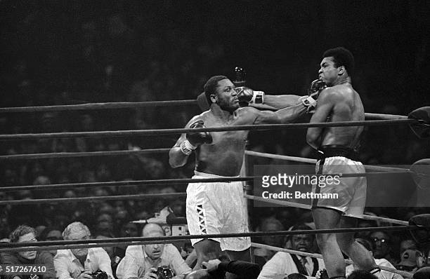Muhammad Ali and Joe Frazier in the midst of their non-title boxing match at Madison Square Garden, New York City, 28th January 1974.