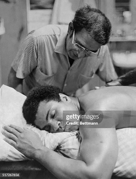 Heavyweight boxer Muhammad Ali takes a snooze after hard training session at his camp here recently, in preparation for title bout in Zaire 9/24 with...