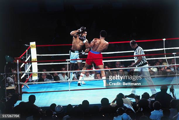 Muhammad Ali versus George Foreman heavyweight title bout. Slide shows Ali leaning back while Foreman leans forward.