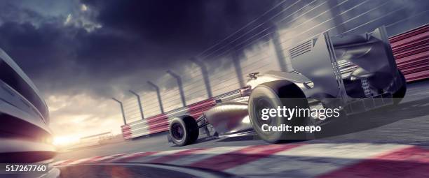 grand prix high speed racing car on racetrack at sunset - motor racing track stock pictures, royalty-free photos & images