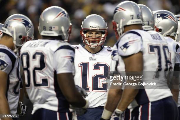 Quarterback Tom Brady of the New England Patriots in the huddle during a game against the Pittsburgh Steelers at Heinz Field on October 31, 2004 in...
