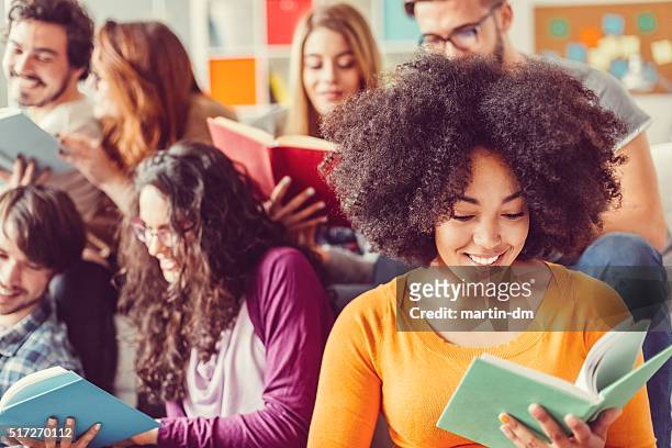 students preparing for exams in the campus library - literature stock pictures, royalty-free photos & images