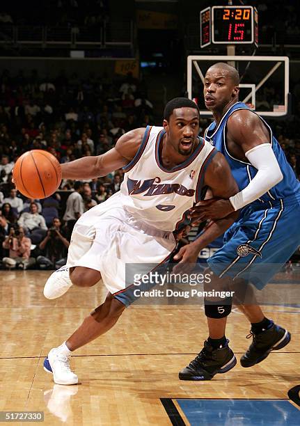 Gilbert Arenas of the Washington Wizards drives against Steve Francis of the Orlando Magic battle as the Wizards defeated the Magic 106-96 during NBA...