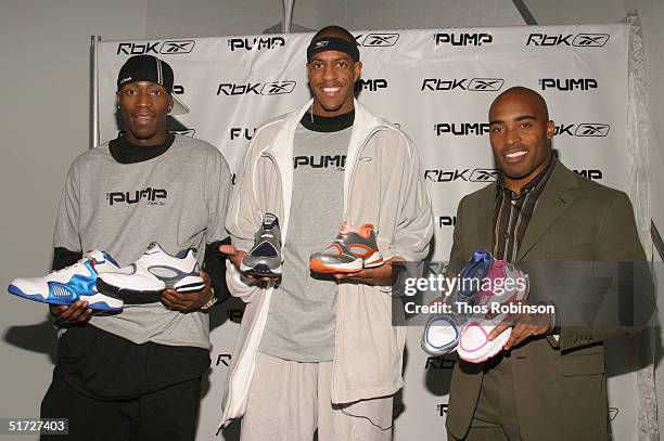 New York Knicks Jamal Crawford and Jerome Williams, and New York Giant Tikki Barber attend the unveiling of the new Reebok Pump 2.0 sneaker November...