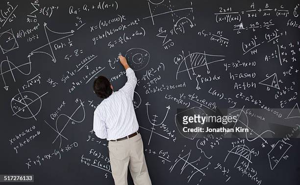 math teacher at chalkboard - lavagna foto e immagini stock
