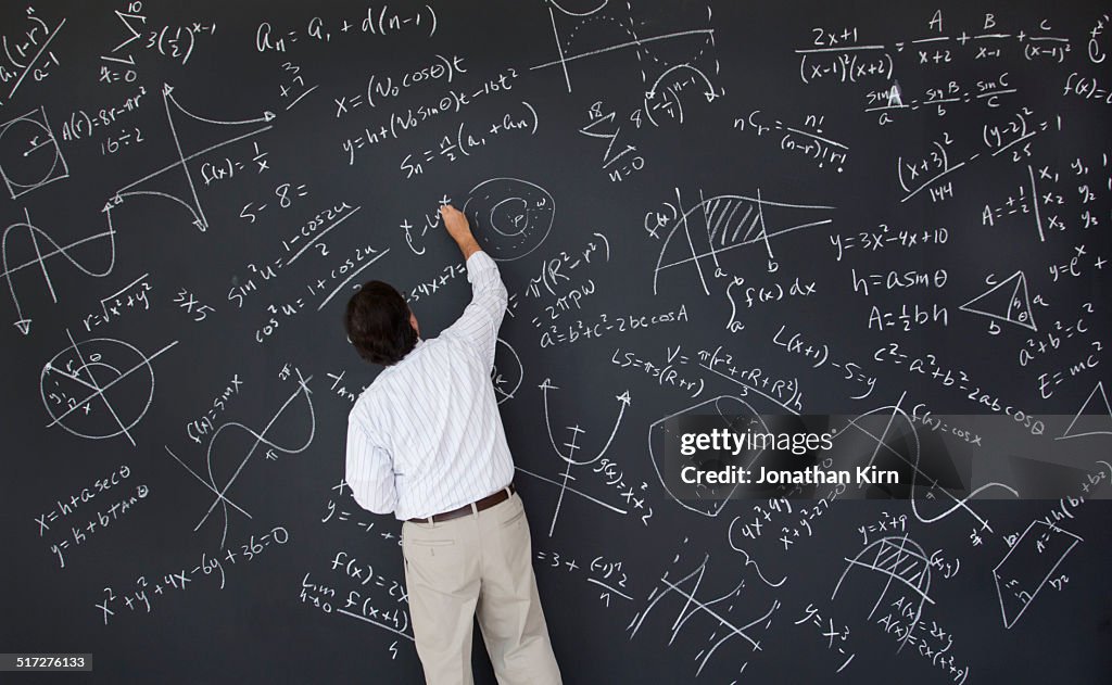 Math Teacher At Chalkboard High-Res Stock Photo - Getty Images