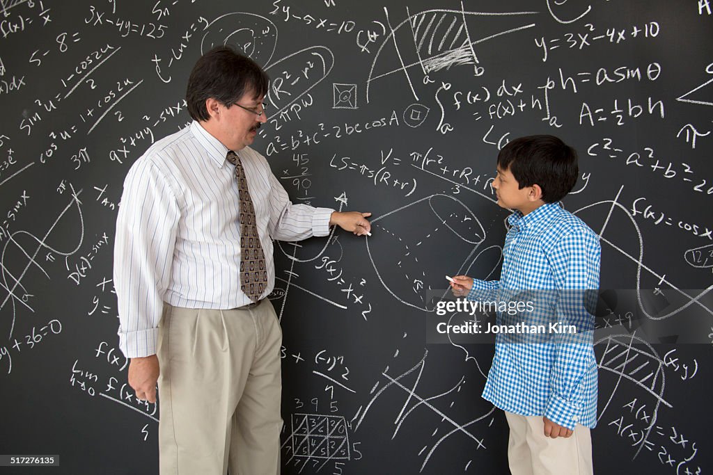 Teacher and student working on math