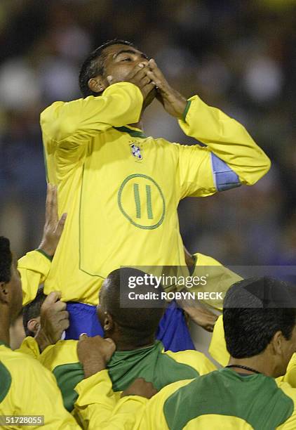 Brazilian striker Romario de Souza Faria blows a kiss after scoring his first of two goals in the second half of "La Gran Despedida", "The Grand...