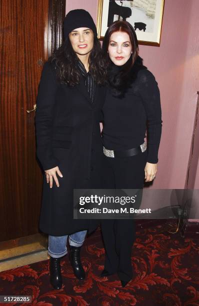 Actresses Demi Moore and Priscilla Presley backstage after seeing 'We Will Rock You', the Queen musical at the Dominion Theatre on November 10, 2004...