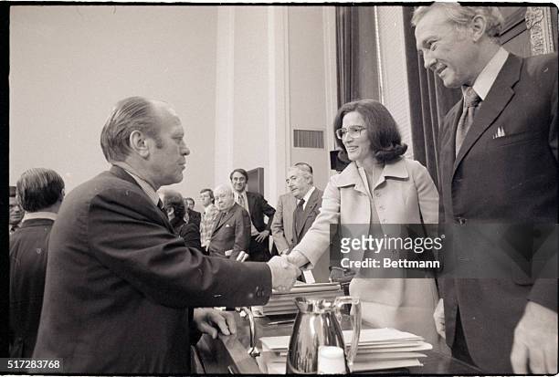 Washington, DC- President Ford shakes hands with Representative Elizabeth Holtzman , after Ford completed his testimony to the House Judiciary...