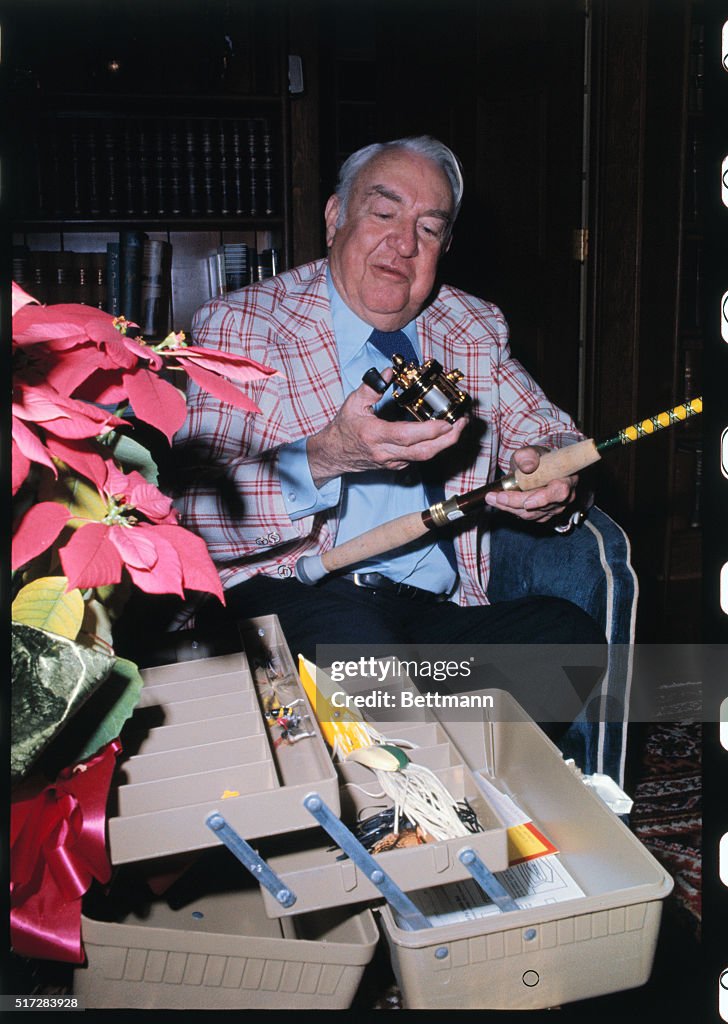 Sam J. Ervin Looking at His Fishing Equipment