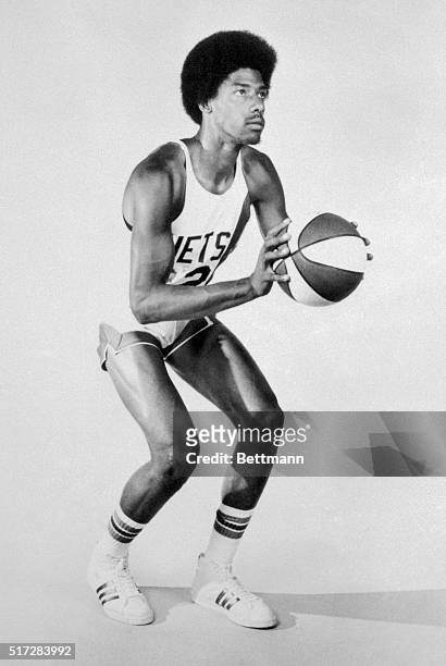 This photo shows Julius Erving close up and poised in uniform.