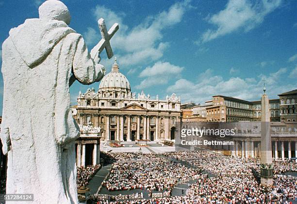 17th century statue of an early Christian saint looks down from atop the famed Bernini colonnade surrounding St. Peter's Square. As in years past,...