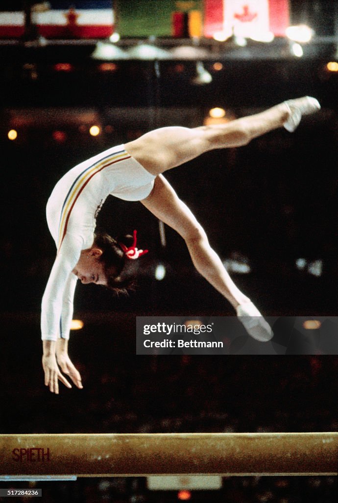 Teodora Ungureanu in Mid Air on Balance Beam