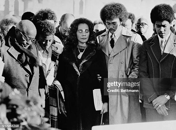 Atlanta. The Martin Luther King, Jr. Family pause in prayer at the Crypt of the slain civil rights leader during services marking his 47th birthday,...