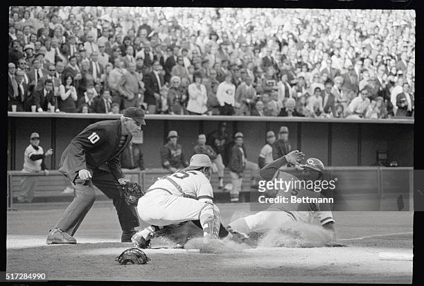 Reds' Johnny Bench is out at home after tagging up at third on Ronnie Stennett's fly to left in fourth inning 10-9. The double play ended the inning....