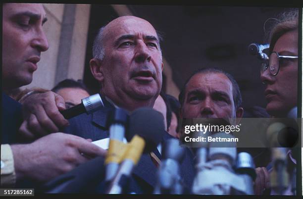 Former Attorney General John Mitchell is surrounded by newsmen following his appearance before a Federal Grand Jury 4/20. Mitchell said he told the...