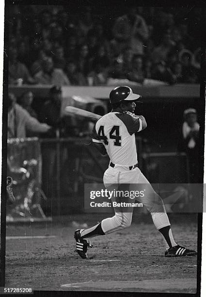 Hank Aaron of the Milwaukee Braves hits his 715th homer in a game with the Dodgers in this photograph.