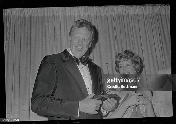 Los Angeles, California: James Arness, star of CBS-Television's Gunsmoke wears a big smile after he was presented the 13th annual International...
