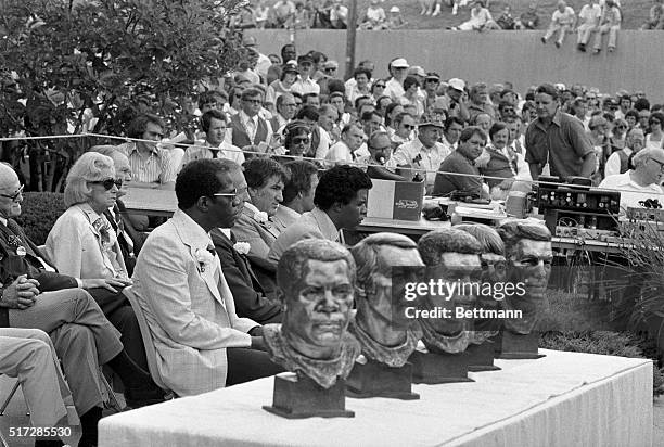 Busts of the inductees to the Football Hall of Fame which include Gale Sayers, Frank Gifford, Bart Starr, Forrest Gregg and Bill Willis.