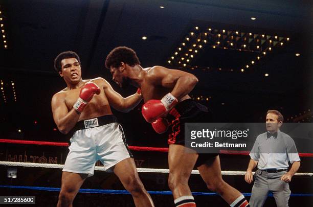 Las Vegas, Nev.: Muhammad Ali and Leon Spinks during ring action at the Las Vegas Hilton Pavilion. Spinks scored one of boxing'[s greatest upsets...