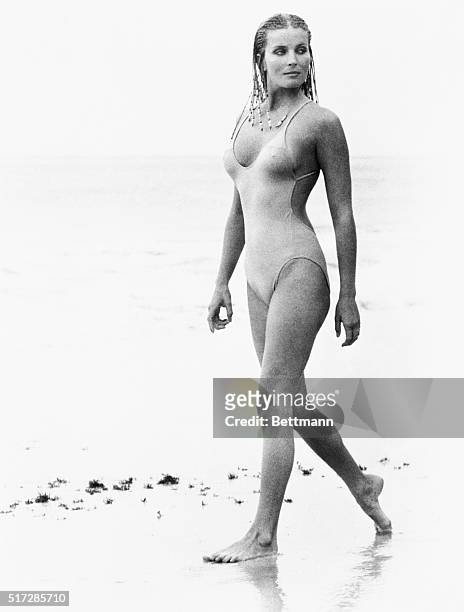 Actress Bo Derek, with her hair in cornrows, walks along the beach in swimwear as Samantha Taylor in the 1979 movie 10, directed by Blake Edwards.