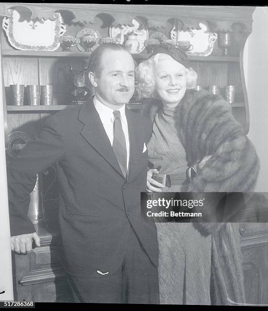 Screen Folk at Christmas Party. Jean Harlow, platinum blonde film beauty, and her husband, Harold Rosson, shown as they attended the Christmas Day...