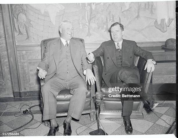 Discussing Louisiana's Troubles: Governor Oscar K. Allen of Louisiana, and Senator Huey Long, pictured in conference at the Governor's office, at...