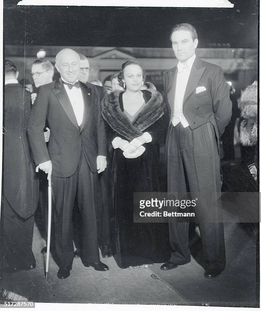 Cecil B. Demille, his daughter, Katherine Demille, and Harry Wilcoxson, as they arrived to attend the film premiere of Queen Christina, at the...