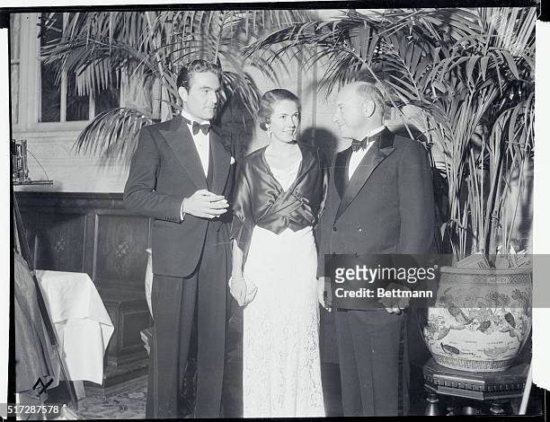 Henry Wilcoxen , Mrs. Frank Calvin and Cecil B. Demille, shown as they attended the Marion Davies Charity Ball held recently at the Biltmore Hotel,...