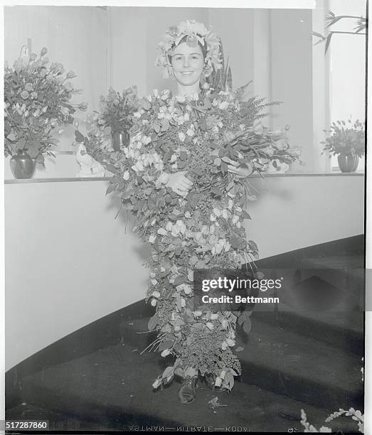 Miss Edith Craker, 19-year-old Los Angeles, California, girl wearing $1,200 costume of cladius pernet roses and valuable orchids, is chosen to open...