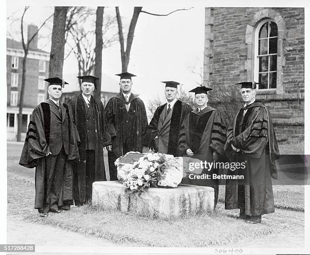 Jerome Barnum, President of the American Newspaper Publishers' Association, lays a wreath at the boulder on the Colby College campus, commemorating...