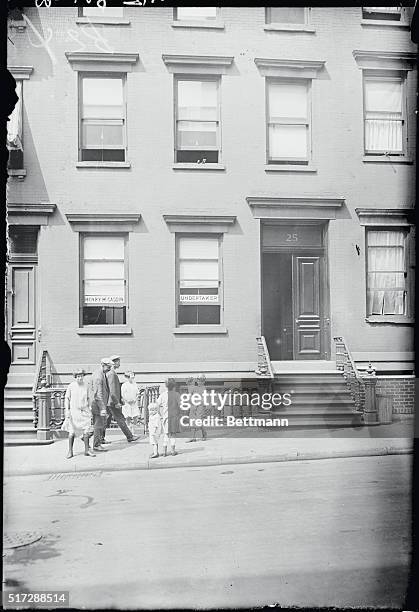 Two views of Al Smith's old home at 25 Oliver Street, which now shelters an undertakers establishment.