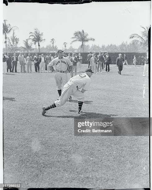 Larry Benton, former Giant pitcher, more recently with the Cincinnati Reds, is shown working out under the Managerial eye of Bill Terry, during a...