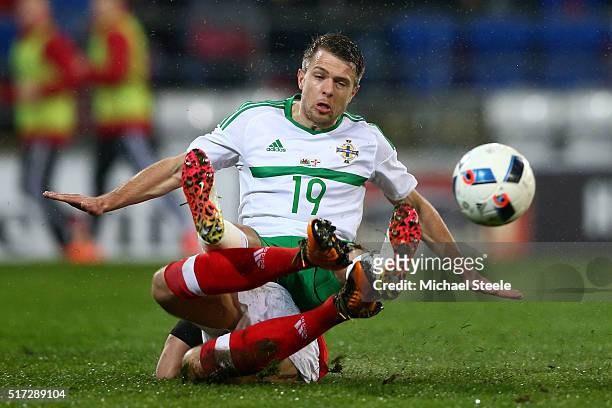 Jamie Ward of Northern Ireland is tackled by Adam Matthews of Wales during the international friendly match between Wales and Northern Ireland at the...