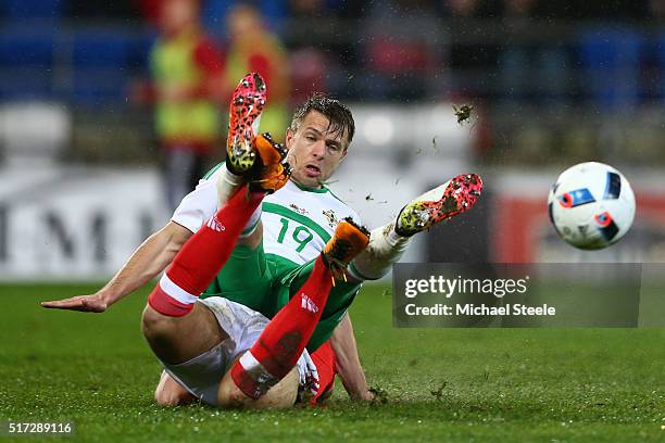 Jamie Ward of Northern Ireland is tackled by Adam Matthews of Wales during the international friendly match between Wales and Northern Ireland at the...