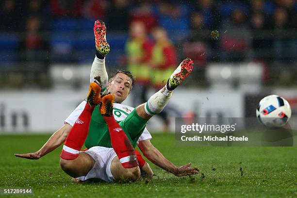 Jamie Ward of Northern Ireland is tackled by Adam Matthews of Wales during the international friendly match between Wales and Northern Ireland at the...