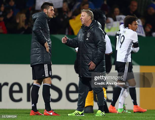 Head coach Horst Hrubesch of Germany talks to Niklas Suele after the 2017 UEFA European U21 Championships qualifier match between Germany U21 and...