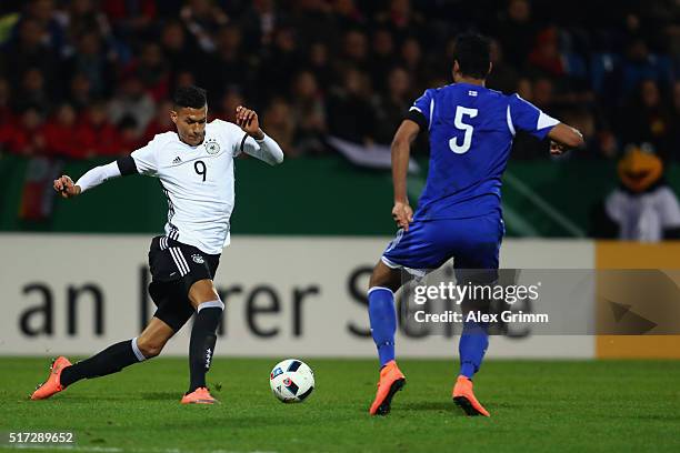 Davie Selke of Germany is challenged by Sonni Ragnar Nattestad of Faroe Islands during the 2017 UEFA European U21 Championships qualifier match...