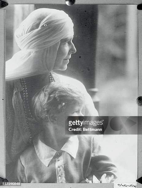 Queen Marie of Rumania with her grandson Prince Michael posing for the Juliet the court photographer at the Royal Palace at Sinaia.