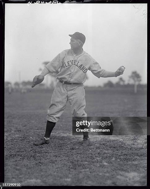 Outfielder Tris Speaker of the Cleveland Indians is shown about to throw the ball.