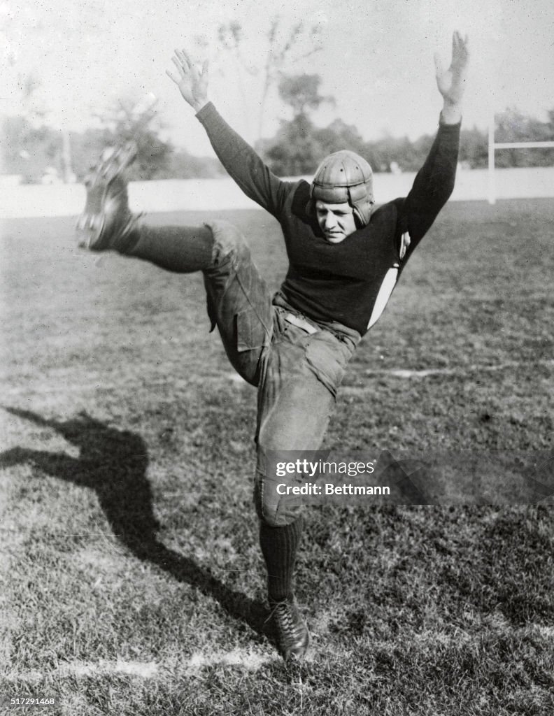 Red Grange Kicking Football